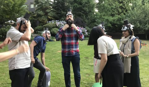 Aaron Draplin et al. that are standing in the grass