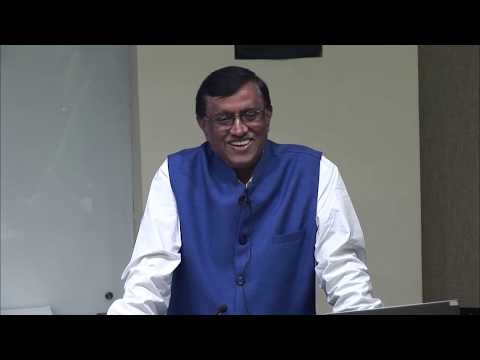 Dnyaneshwar Mulay wearing a suit and tie