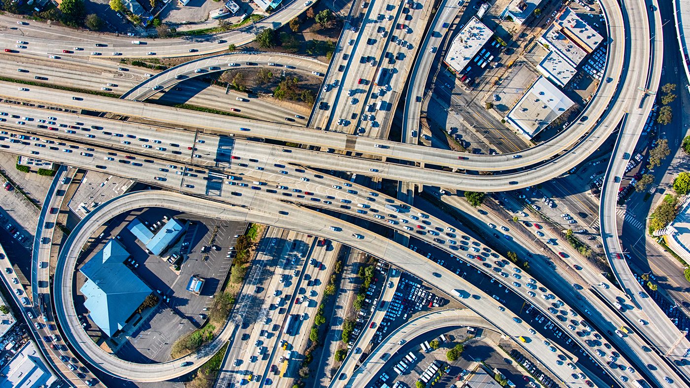 aerial view of crowded freeways and interchanges