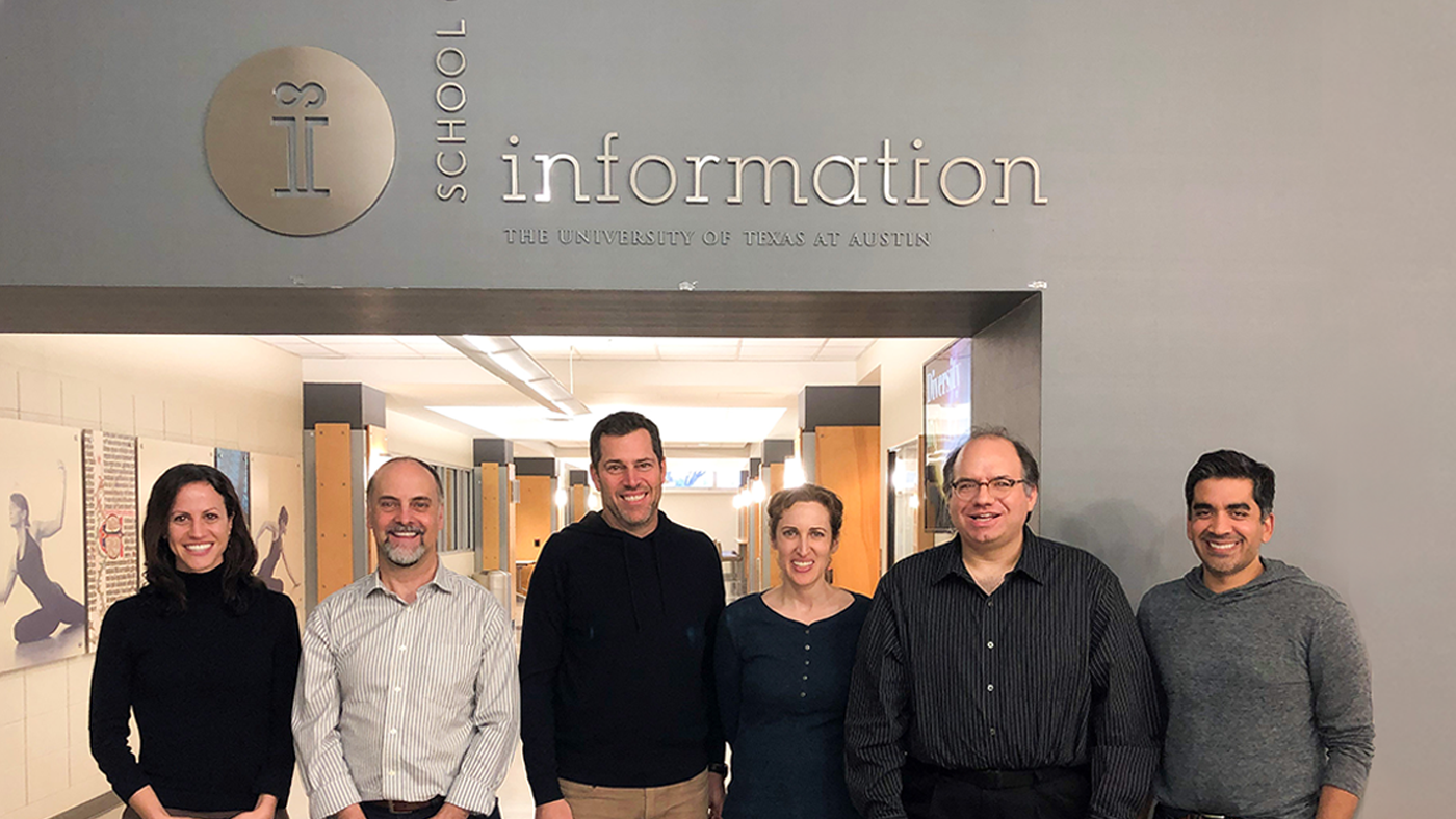 microsoft ability team stands in front of sign at university of texas at austin