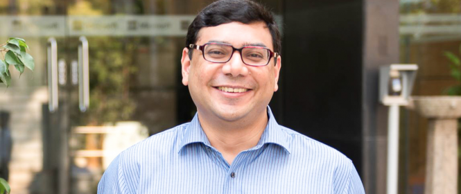 a man standing in front of a building