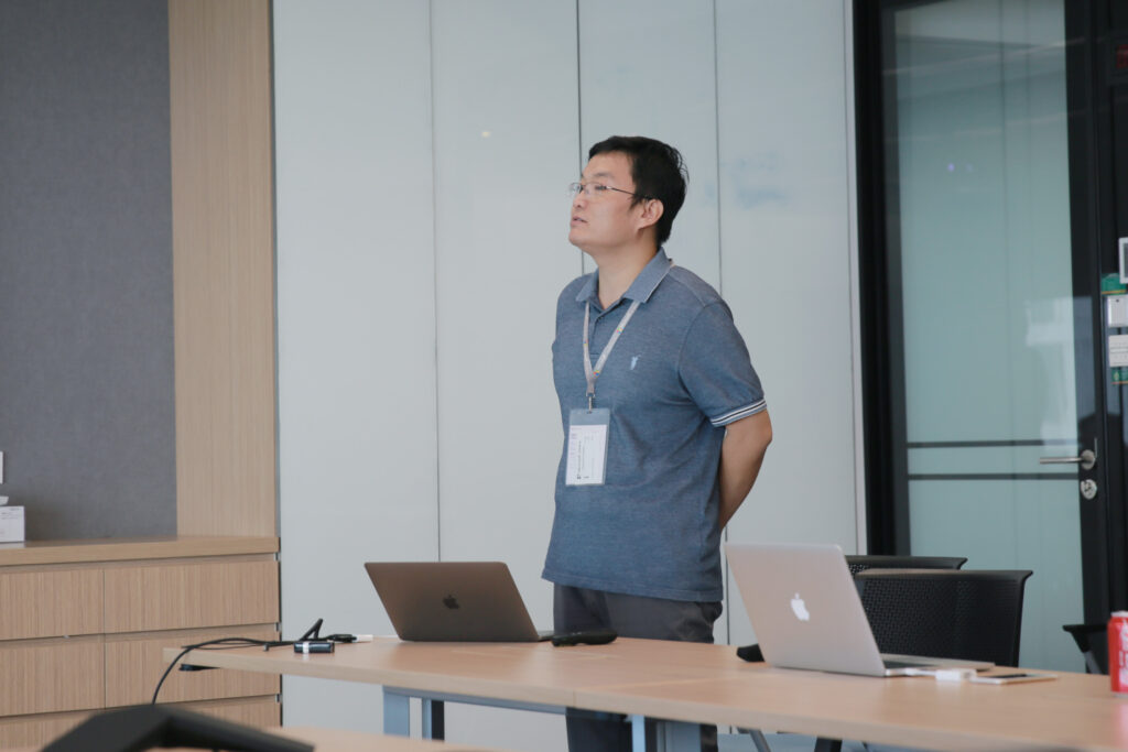 a person standing in front of a computer