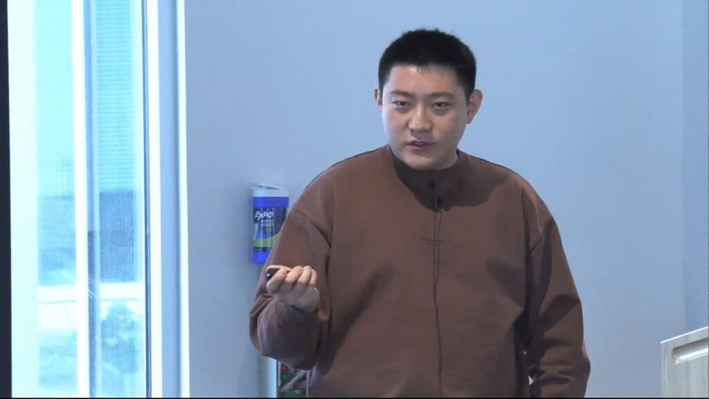 a man standing in front of a window