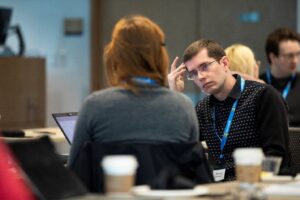 a group of people sitting at a table