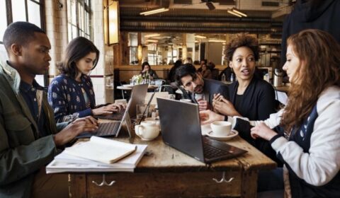 a group of people sitting at a table