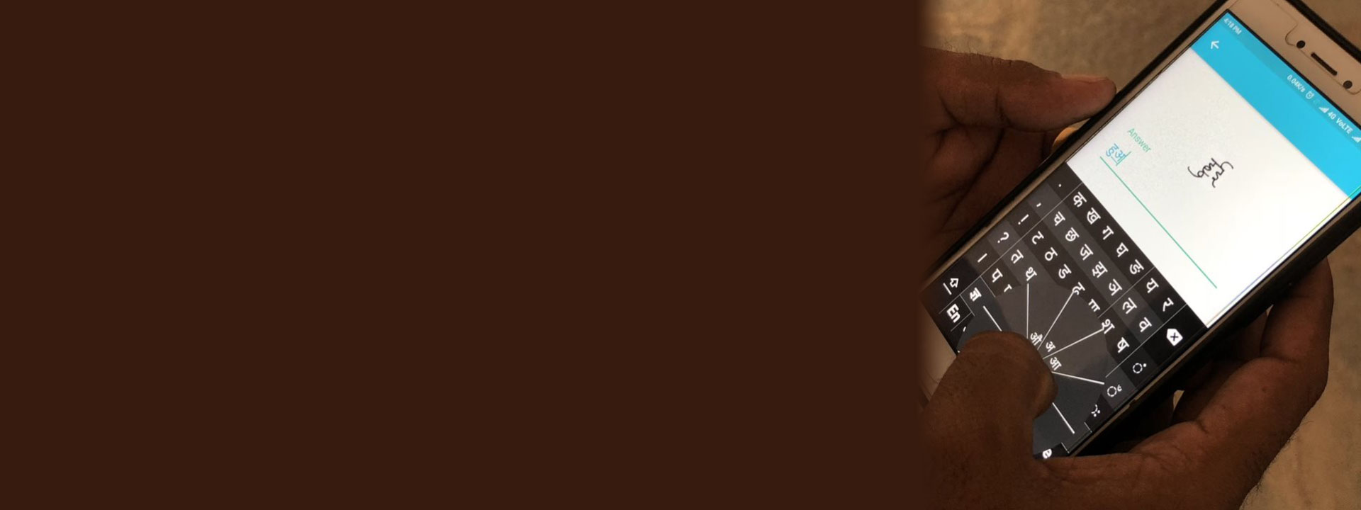 Project Karya header - hand holding a cellphone