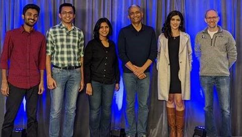 a group of people posing for a photo