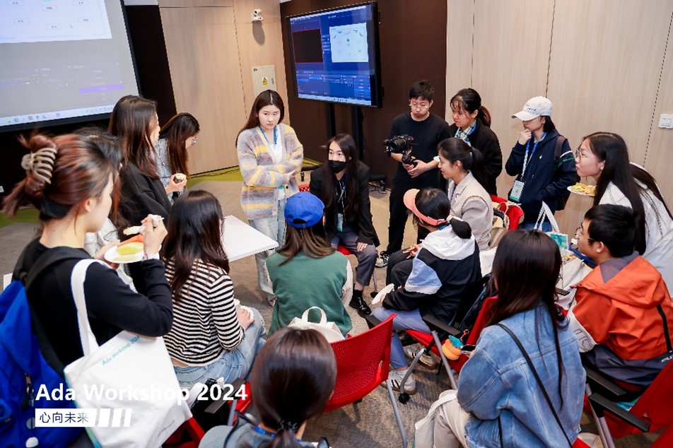 a group of people sitting in front of a crowd