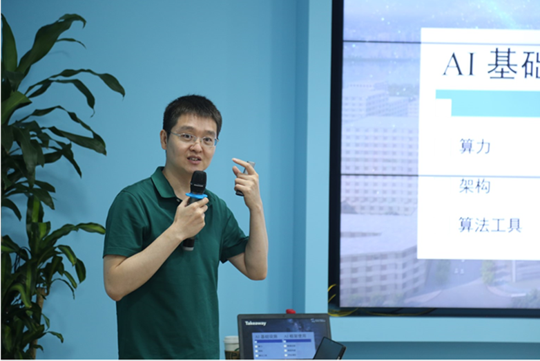 a man standing in front of a computer screen