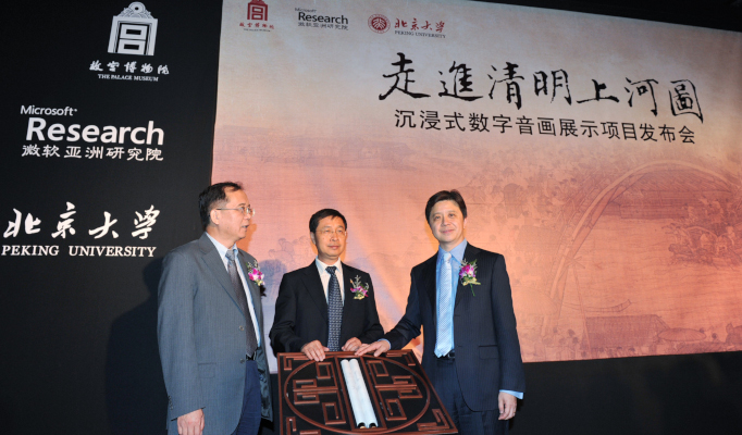 a group of people standing in front of a sign