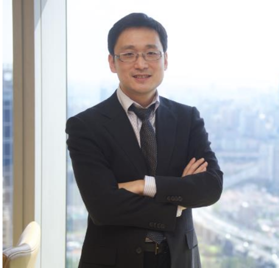 a person standing in front of a window posing for the camera