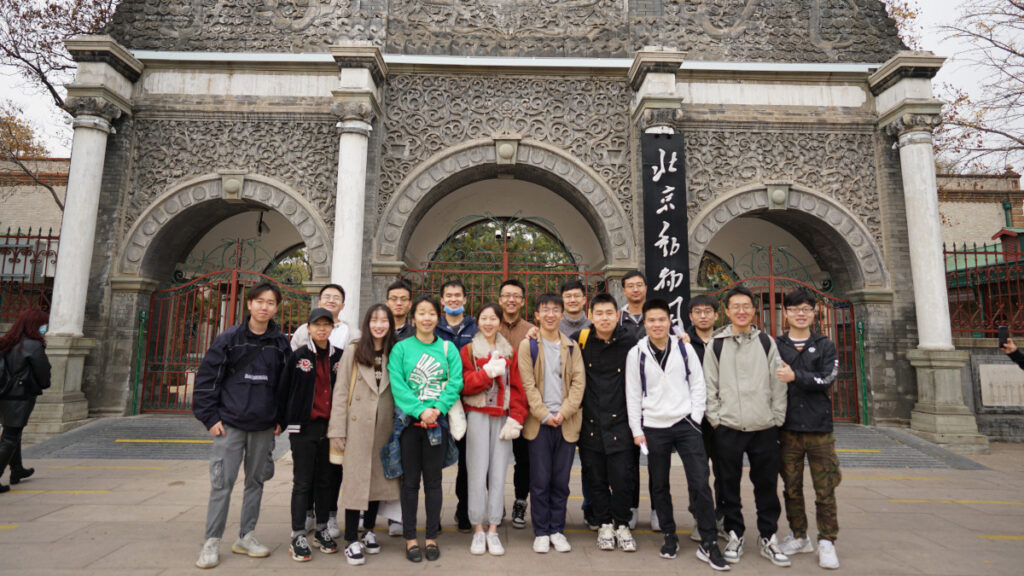 a group of people standing in front of a building