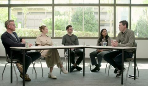 a group of people sitting around a table
