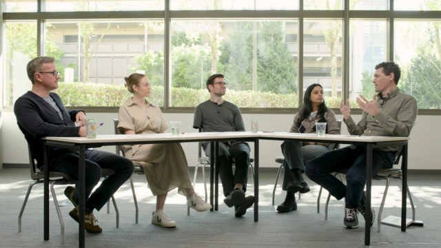 Jonathan M. Carlson, Will Guyman, Matthew Lungren, Cameron Runde, and Smitha Saligrama sitting around a table