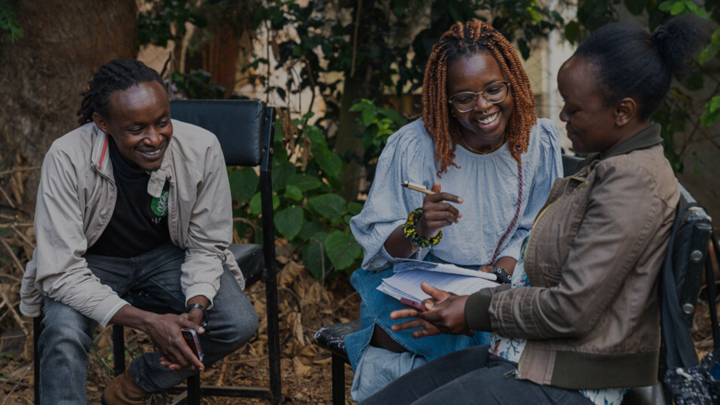 Paza | three people conversing