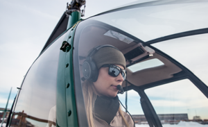 Image of a woman in a helicopter.