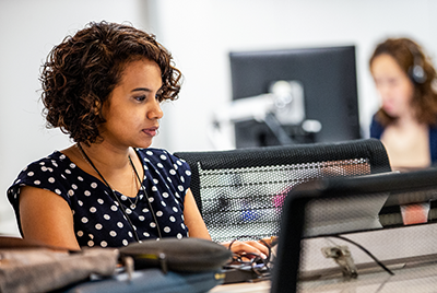Image of a worker at her desk.