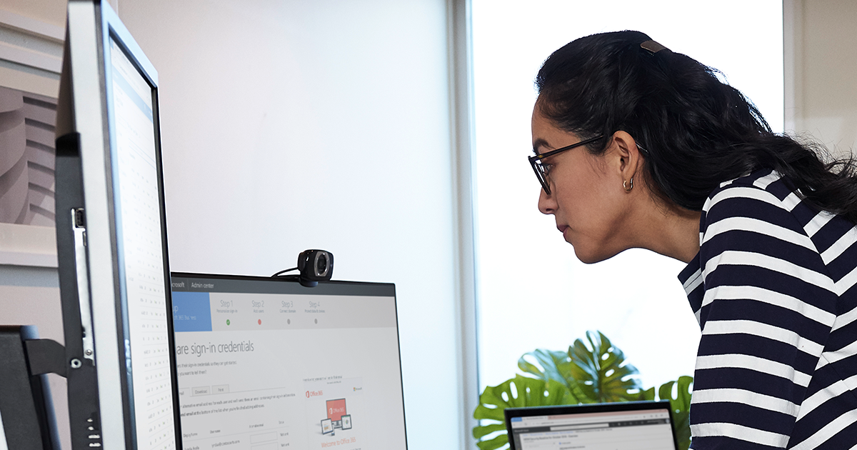 Image of a remote worker on her desktop PC.