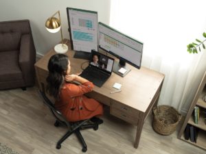 A woman having a Microsoft Teams in her living room home office on her Acer TravelMate P6.