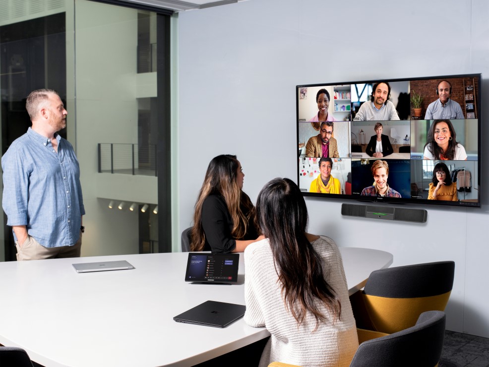 A group of people interfacing over a virtual meeting.