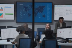 CISO (chief information security officer) collaborating with practitioners in a security operations center.