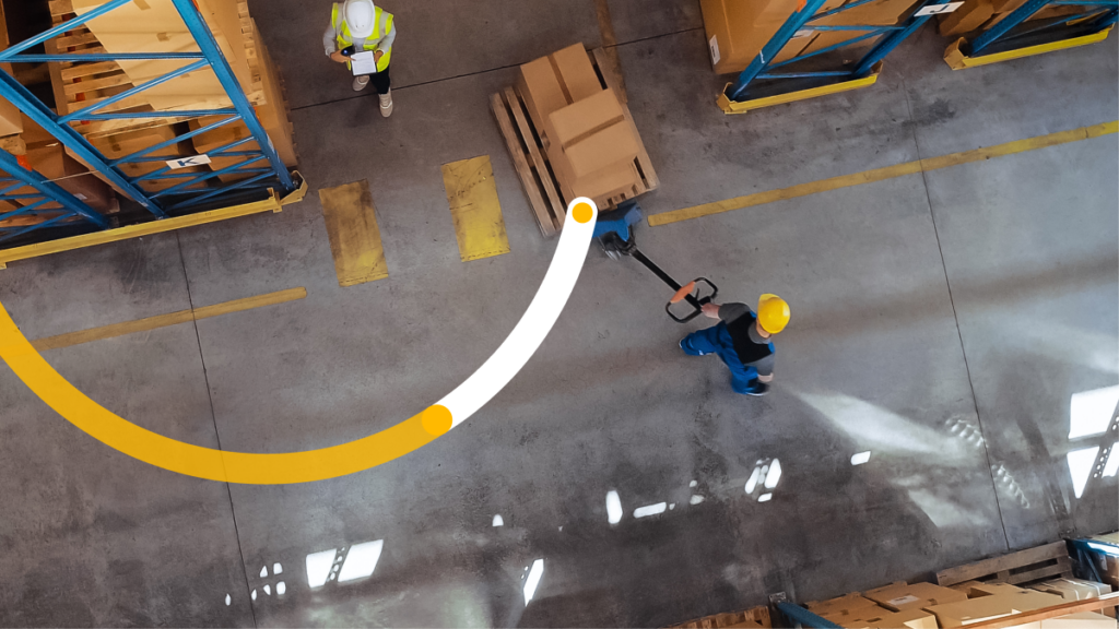 Two people working in a warehouse.