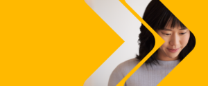 Stop Ransomware with Microsoft Security digital event yellow blog banner with woman working at computer.