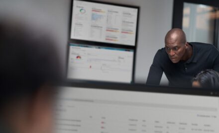 Chief information security officer collaborating in a security operations center.