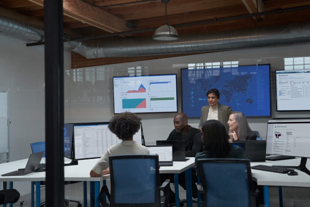 Chief information security officer collaborating with practitioners in a security operations center.