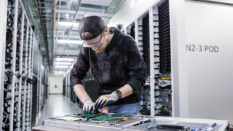 Datacenter service technician working on server rack