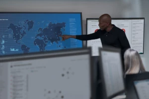 Chief information security officer collaborating in a security operations center.