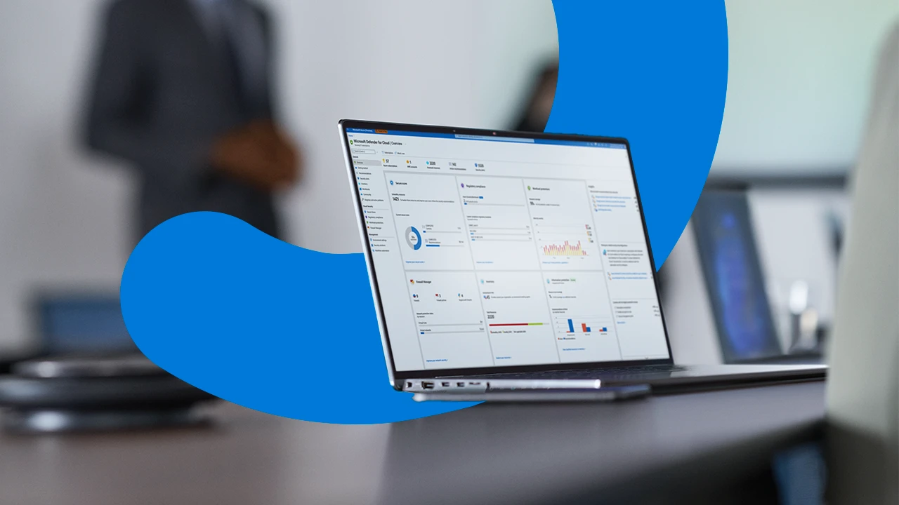 Camera focused on laptop screen showing security dashboard while security decision makers (DMs) present to the board of executives on security topics.