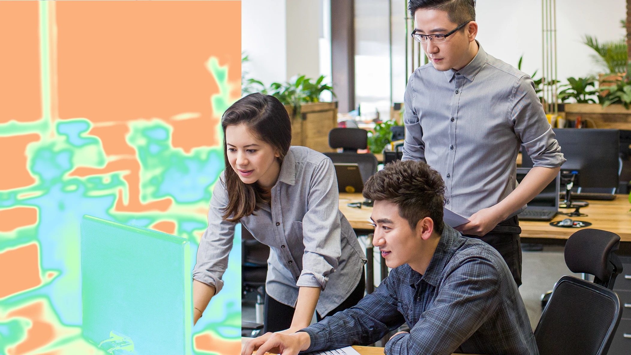 A group of people looking at a computer screen