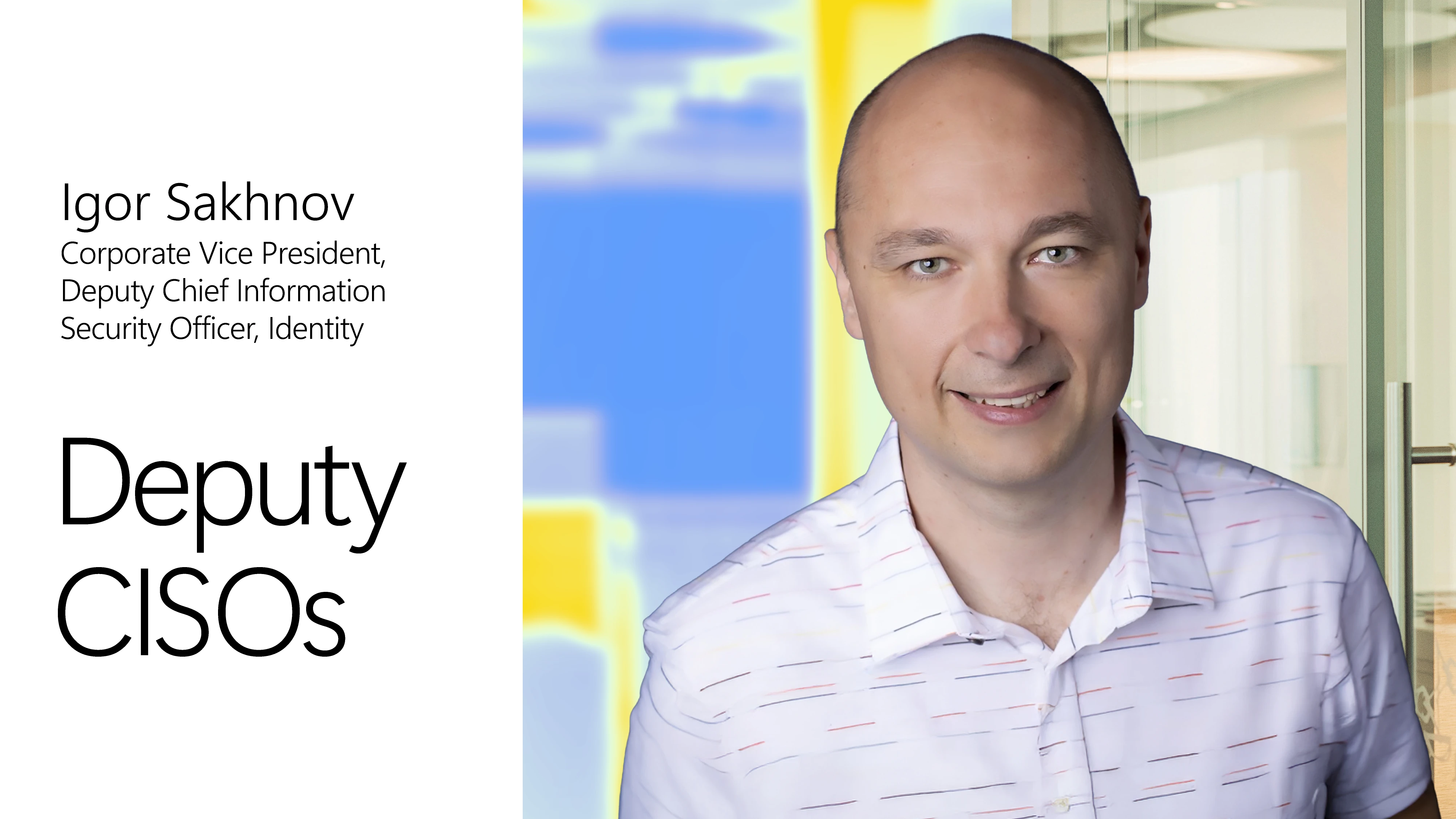 A man in a striped shirt with blue background and black text.