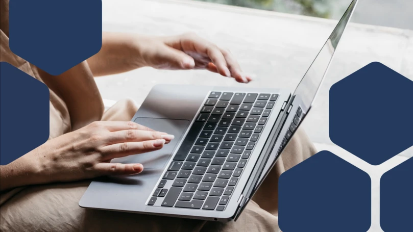 Person typing on a laptop