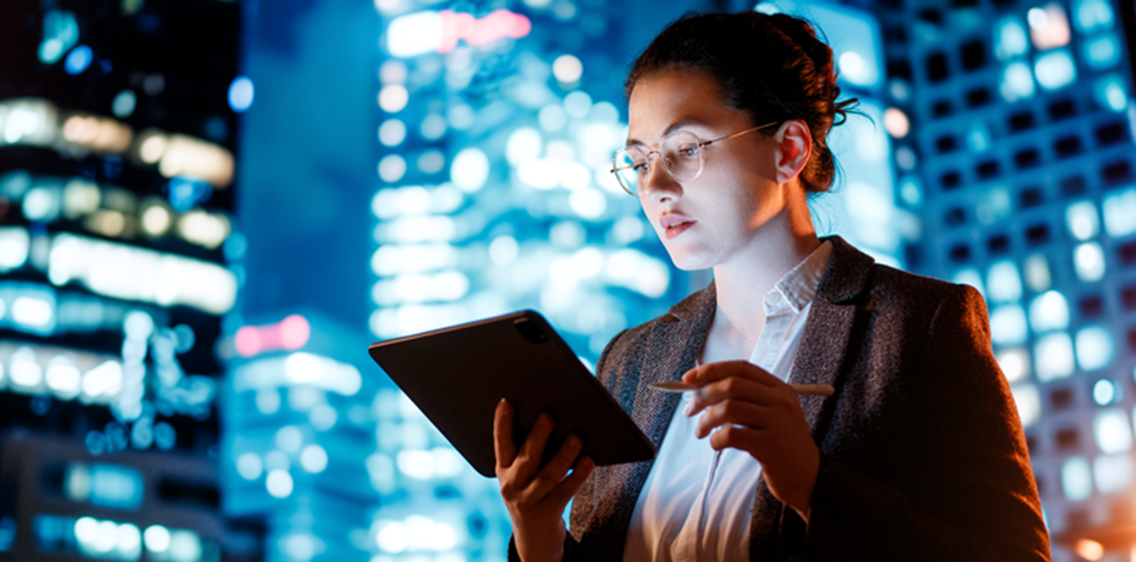 A woman holding a tablet computer.