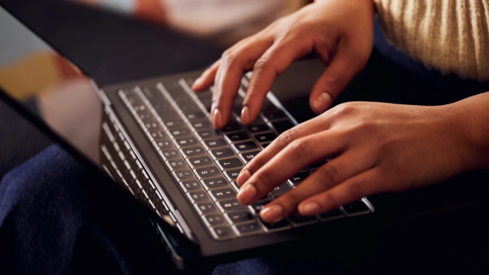 Female developer typing on a keyboard
