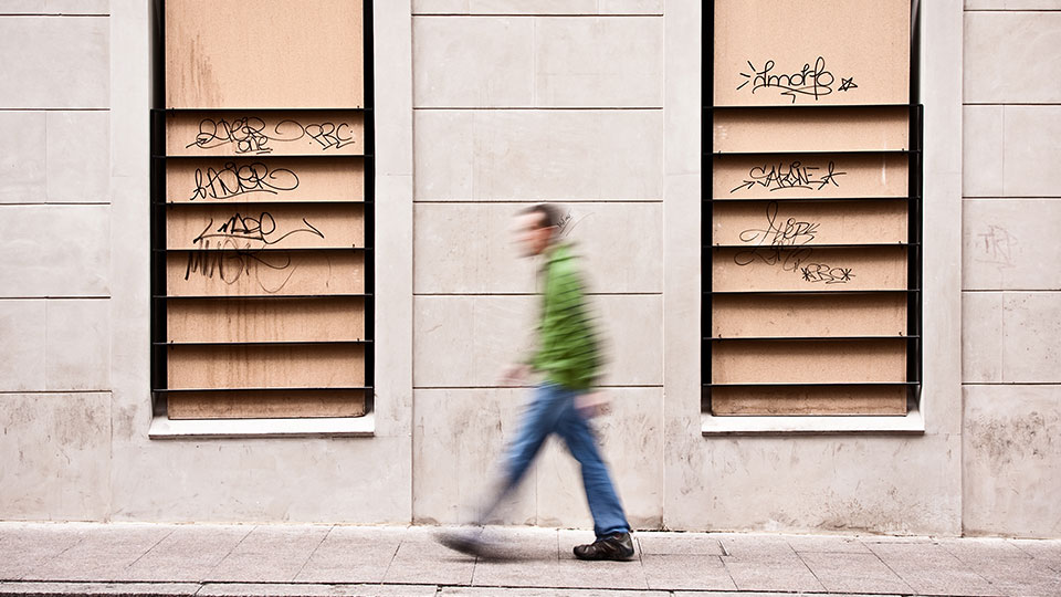 An abstraction of a man walking down a street