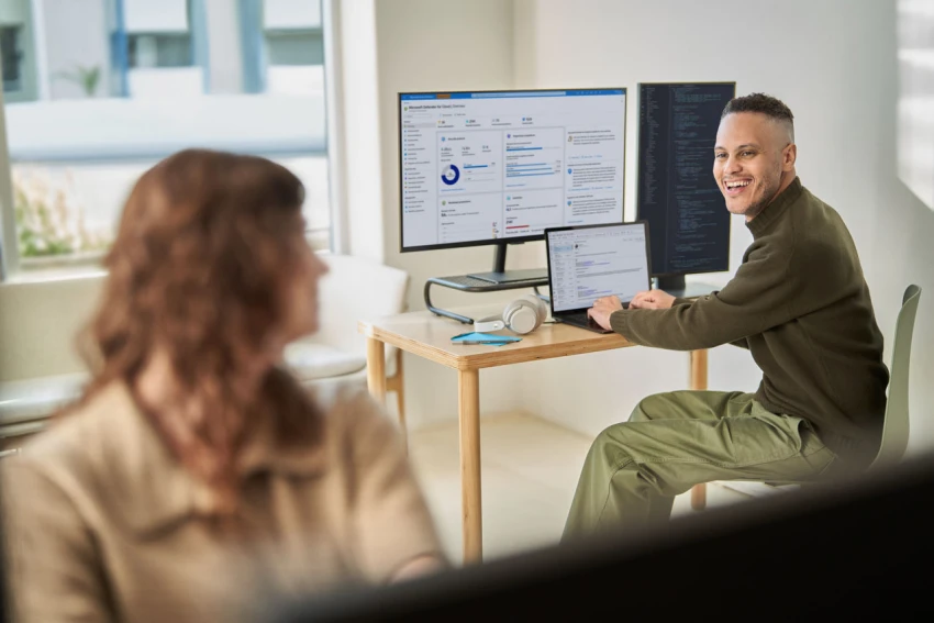 standing on chair and working on computer