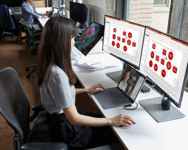 A woman viewing a PowerPoint in two languages