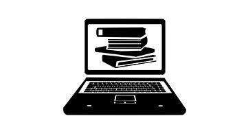 Bärbar dator med böcker