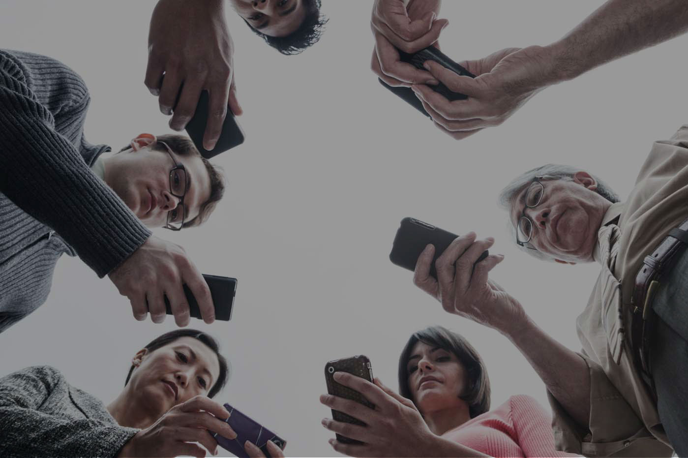 Aerial view of a group of people with mobile devices.