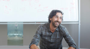 a man standing in front of a window