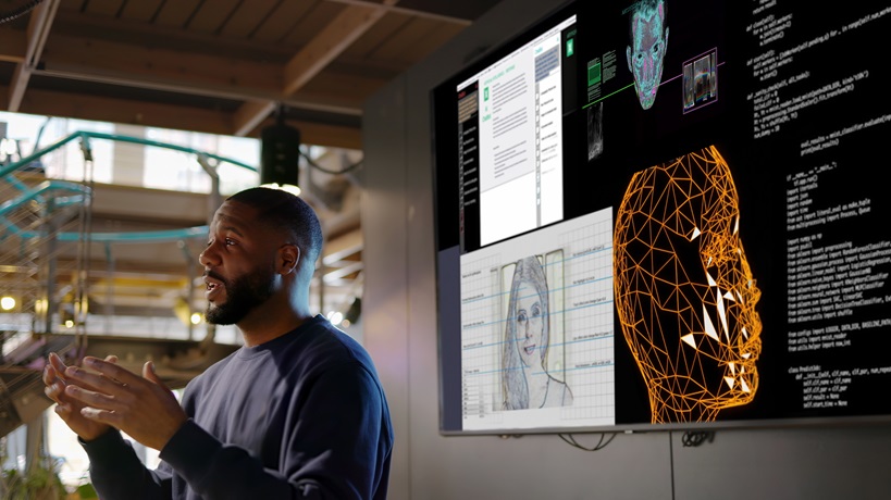 A man presents on facial recognition technology, emphasizing Microsoft's commitment to responsible AI development and its focus on addressing bias and ensuring fairness in AI systems.