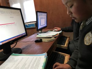 A student at the Lukla Primary School tries out using Microsoft Word on a Surface 3 tablet.