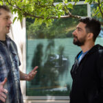 Frank Delia and Pranav Farswani talk animatedly in front of a Microsoft building.