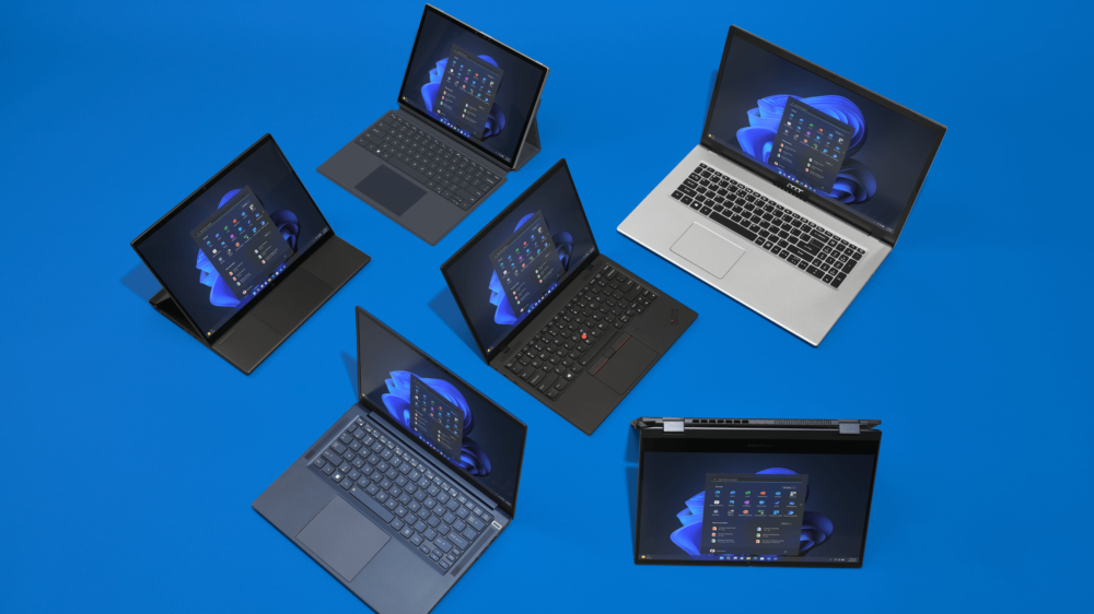 Six laptops from several different companies shown in a cluster.