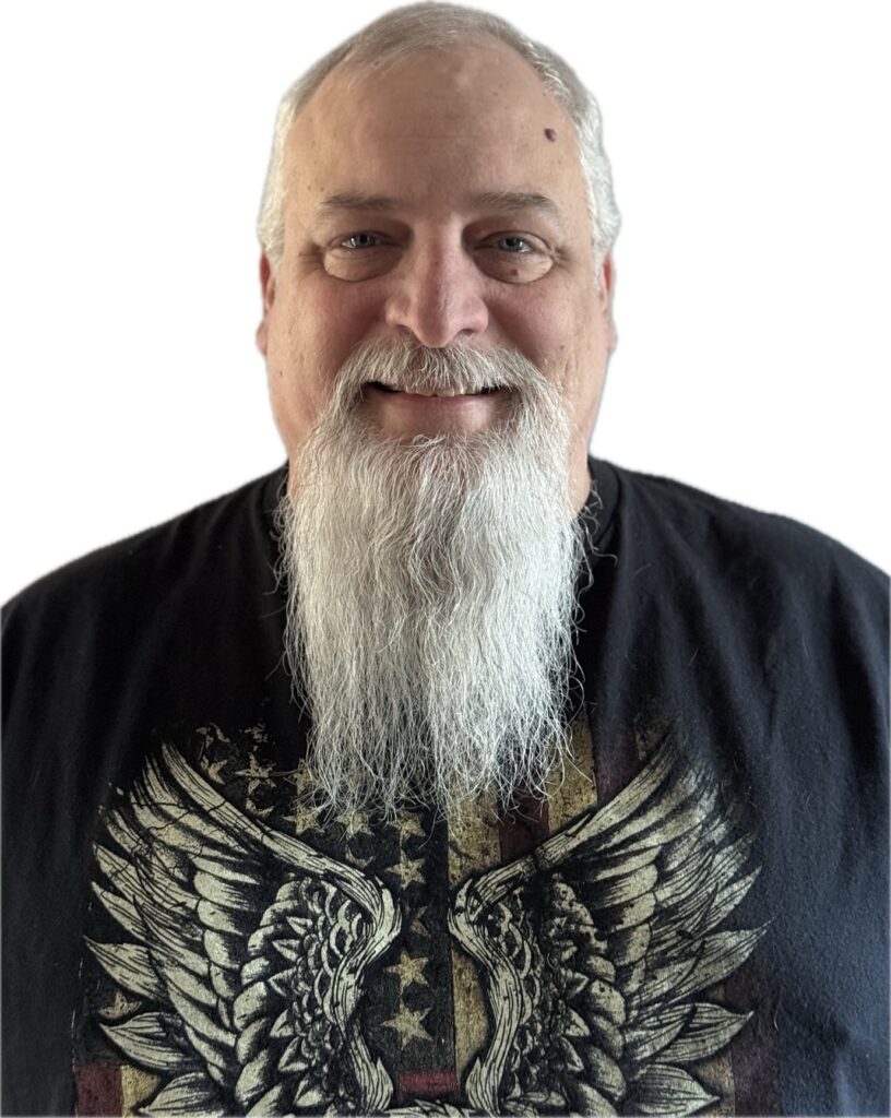 Shaw smiles in a portrait photo.