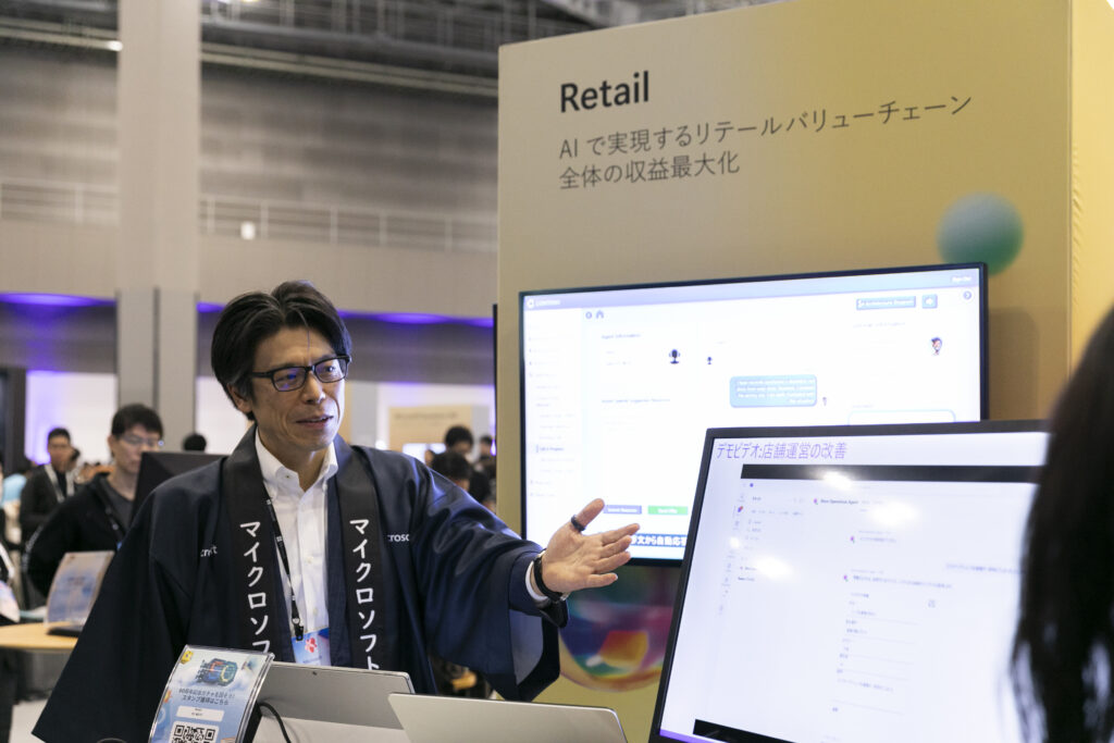 A man standing in front of a computer screen