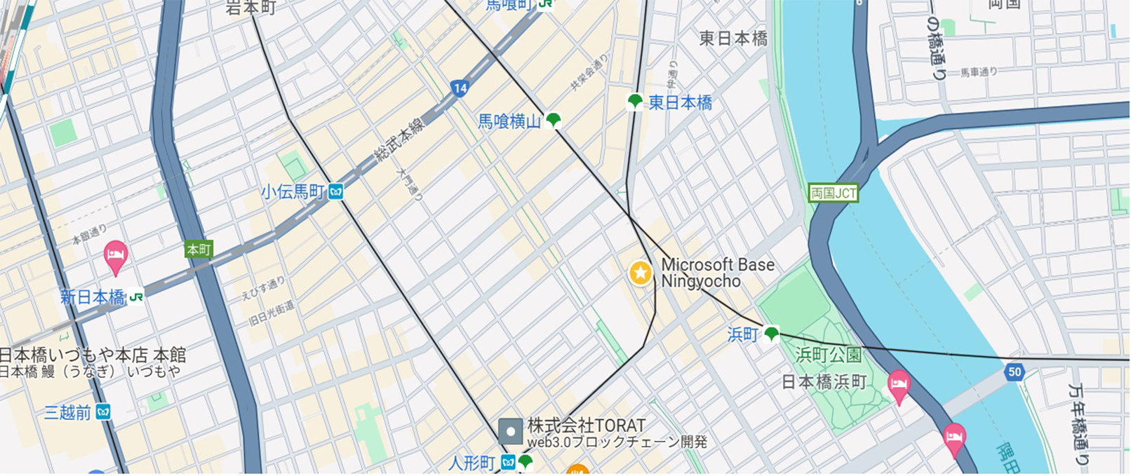 人形町周辺の地図で、道路、建物、水路が描かれ、「Microsoft Base Ningyocho」が星のピンで示されています。